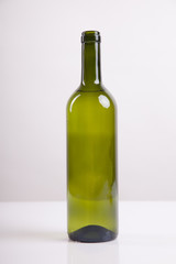 Green glass bottle with white wine