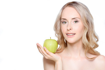 Woman holding apple on hand