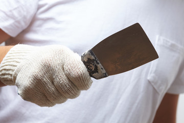 men with putty knife
