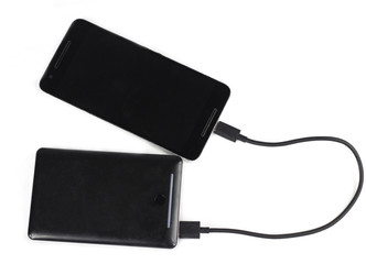 Portable charger charging a smart phone