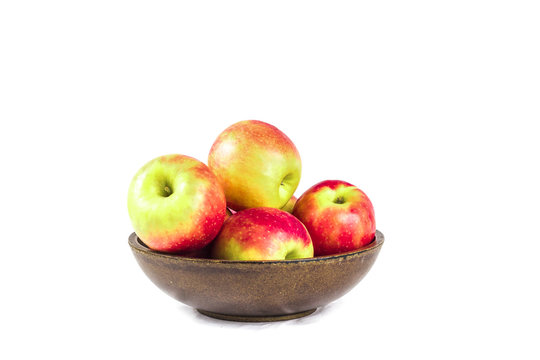 Pink lady aples in a wooden bowl