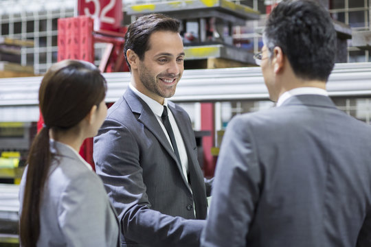Business people talking in the factory