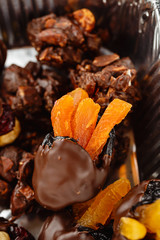 Prunes with dried apricots in chocolate