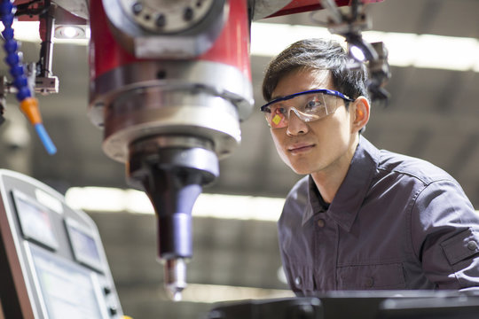 Young engineer working in the factory