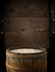 Fototapeta premium background of barrel and worn old table of wood