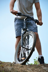 Athlete on a mountain bike on the rise. Healthy lifestyle