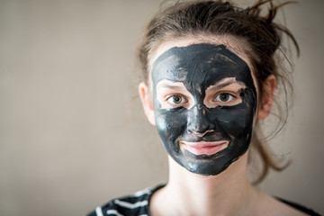 Obraz premium Teenage girl with black mask