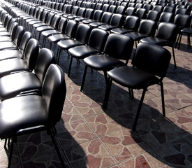 The chairs for spectators are in straight rows.