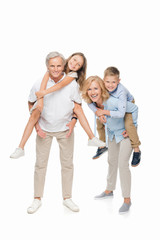 Fototapeta na wymiar kids piggybacking on grandparents
