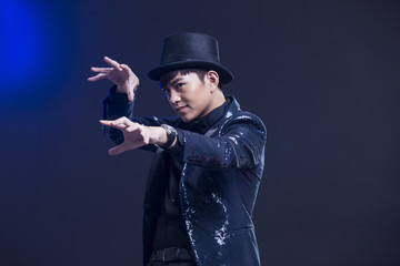 Young magician performing magic trick