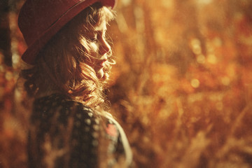 Beautiful little girl in autumn Park