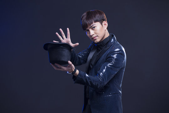 Young magician performing magic trick