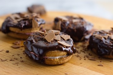 Cinnamon and marshmallow sandwich cookies topped by chocolate