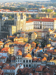 Fototapeta na wymiar Cityscape of Porto, Portugal, viewed from the Torre dos Clerigos - buildings, traditional houses and landmarks in sunset light
