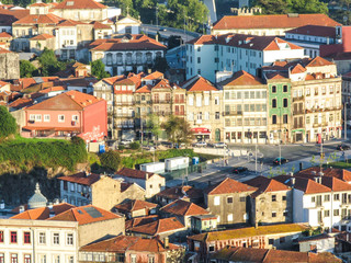 Cityscape of Porto, Portugal, viewed from the Torre dos Clerigos - buildings, traditional houses and landmarks in sunset light