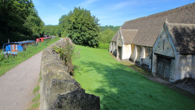 Exterior view of the historic Tithe Barn beside Kennet and Avon canal, Bradford on Avon, UK