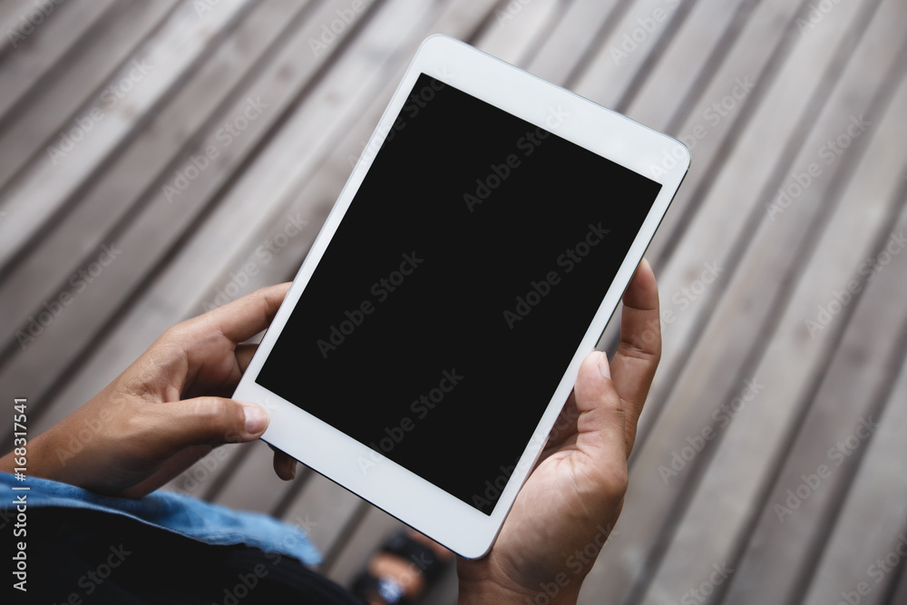 Aufkleber digital tablet in hand on top angle view