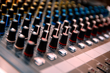 Selective focus professional audio mixing console panel.technology and entertainment concept