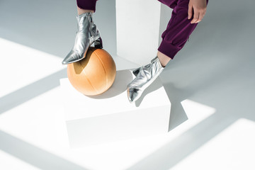 woman in silver colored boots