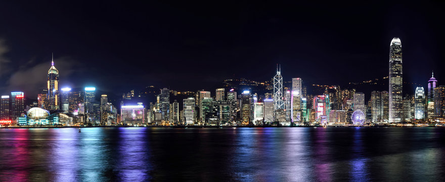 Panorama view of Hong Kong city skyline at night - Powered by Adobe