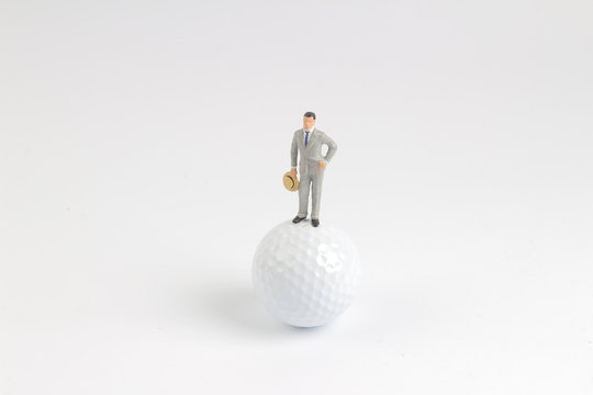 fun of business figure stand on the golf