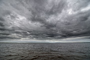 Dark cloudy sky and water