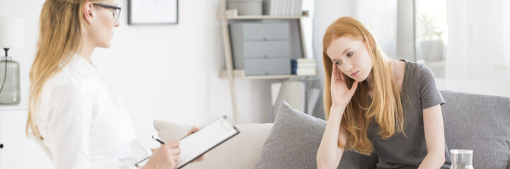 Young woman having psychological consultation