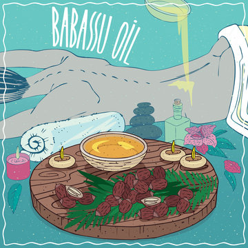 Wood Bowl of Babassu oil and seeds of Attalea speciosa plant. Oil flows on the back of the lying girl. Natural vegetable oil used for body massage