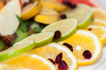 Fresh fruit salad with mixed fruits served on a plate