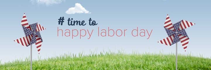 Happy labor day text and USA wind catchers in front of grass and