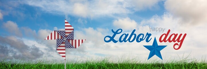 Happy labor day text and USA wind catcher in front of grass and 