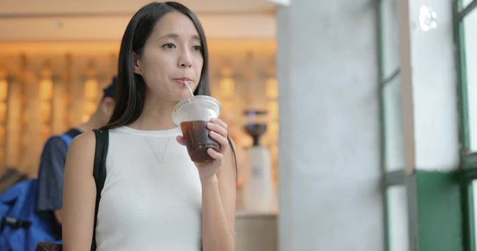 Woman enjoy coffee and using cellphone at cafe