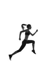 Fototapeta na wymiar Black silhouette of a girl in sportswear jumping against a white background, studio