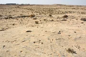 Rocky deserted landscape at Jebel Jassassiyeh site in Northern Qatar.