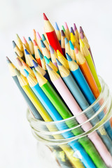 Fototapeta premium Colored Pencils With Red Sticking Up Higher