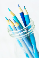 Pastel Blue Colored Pencils In Glass Jar