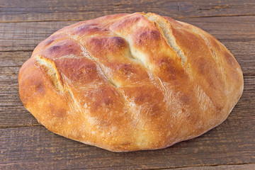 Homemade bread on wooden background