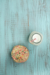 Fototapeta na wymiar Confetti Cookies with Glass of Milk From Above