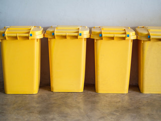 A row of yellow trash on the floor.