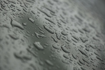 rain drops on car with glass coating protection skin