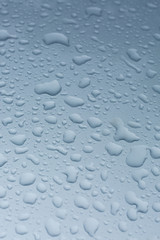 rain drops on car with no glass coating protection skin