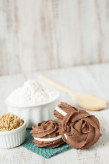Obraz na płótnie Canvas Chocolate Cookies With Flour Brown Sugar and Spoon