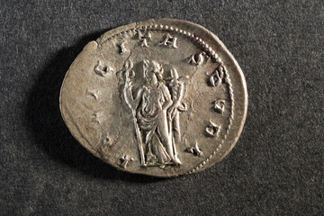 old antique european historical coin on black background