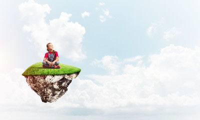 Concept of careless happy childhood with girl dreaming about something