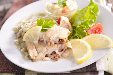 fish with sauce and vegetables