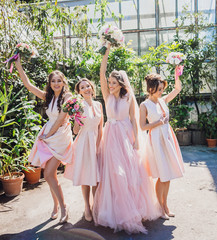 Stunning bride and bridesmaids pose outside