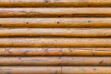 Old wall of logs. Cose up background.