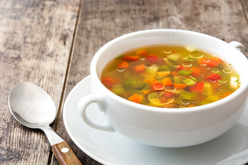 Vegetable soup in bowl on wooden table
