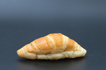 tuna croissant on black background