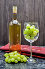 winebottle and glas with grape close up